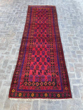 Hand-knotted Afghan Belouchi rug runner with vibrant red background, blue, and orange geometric patterns, measuring 4'0" x 12'2