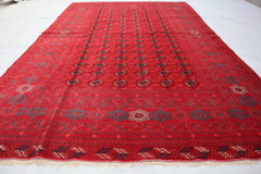 Afghan Bokhara handmade rug with intricate geometric patterns in red, black, and beige, 6.5 x 9.0 feet.