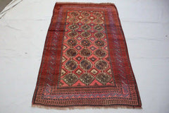 Afghan Chob Bash handmade rug with geometric patterns in red, orange, blue, and black, 4.6 x 7.0 feet.